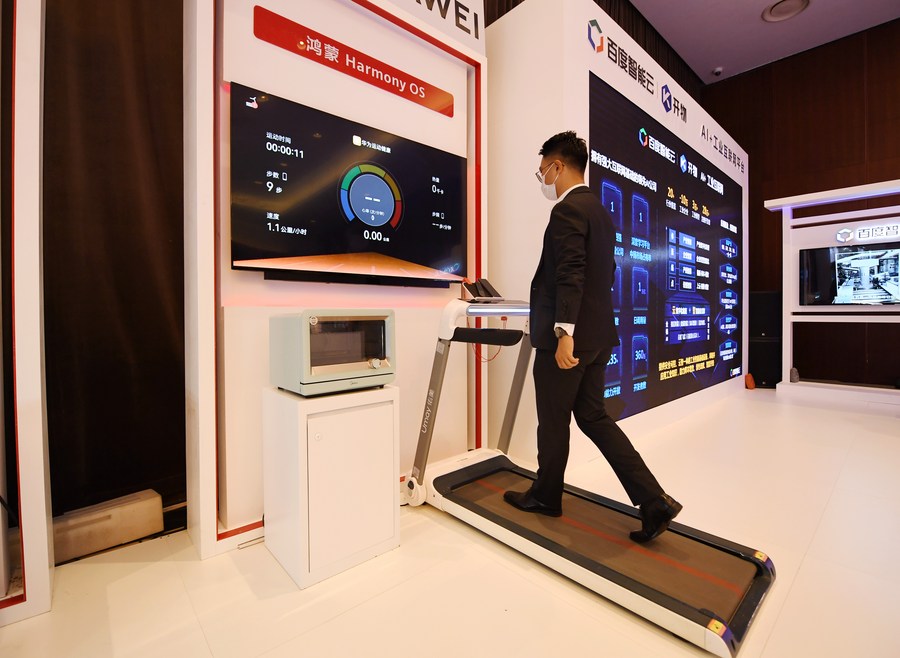 A staff member shows a product during the 2021 Global Digital Economy Conference in BeijingPhoto by Xinhua/Zhang Chenlin.