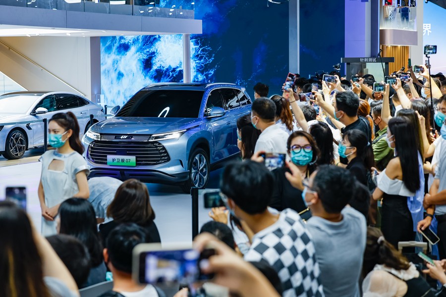 Visitors take photos of a car from BYD at the Chengdu Motor Show 2022 in Chengdu, capital of southwest China's Sichuan Province. Photo by Xinhua/Shen Bohan.