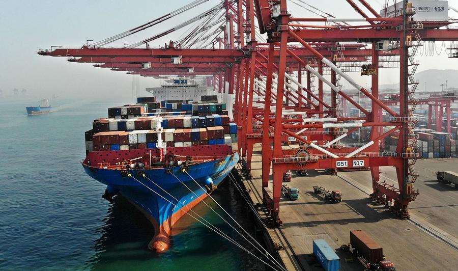 A cargo ship docking at Qingdao Port, east China's Shandong Province. Photo by Xinhua/Li Ziheng.