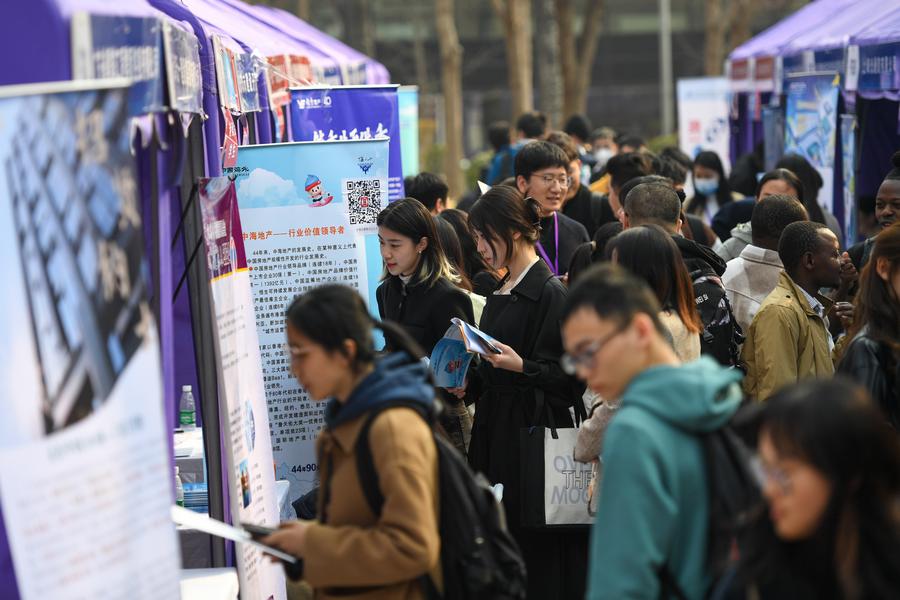 Students attend a job fair at Tsinghua University in Beijing, capital of China. Photo by Xinhua/Ju Huanzong.