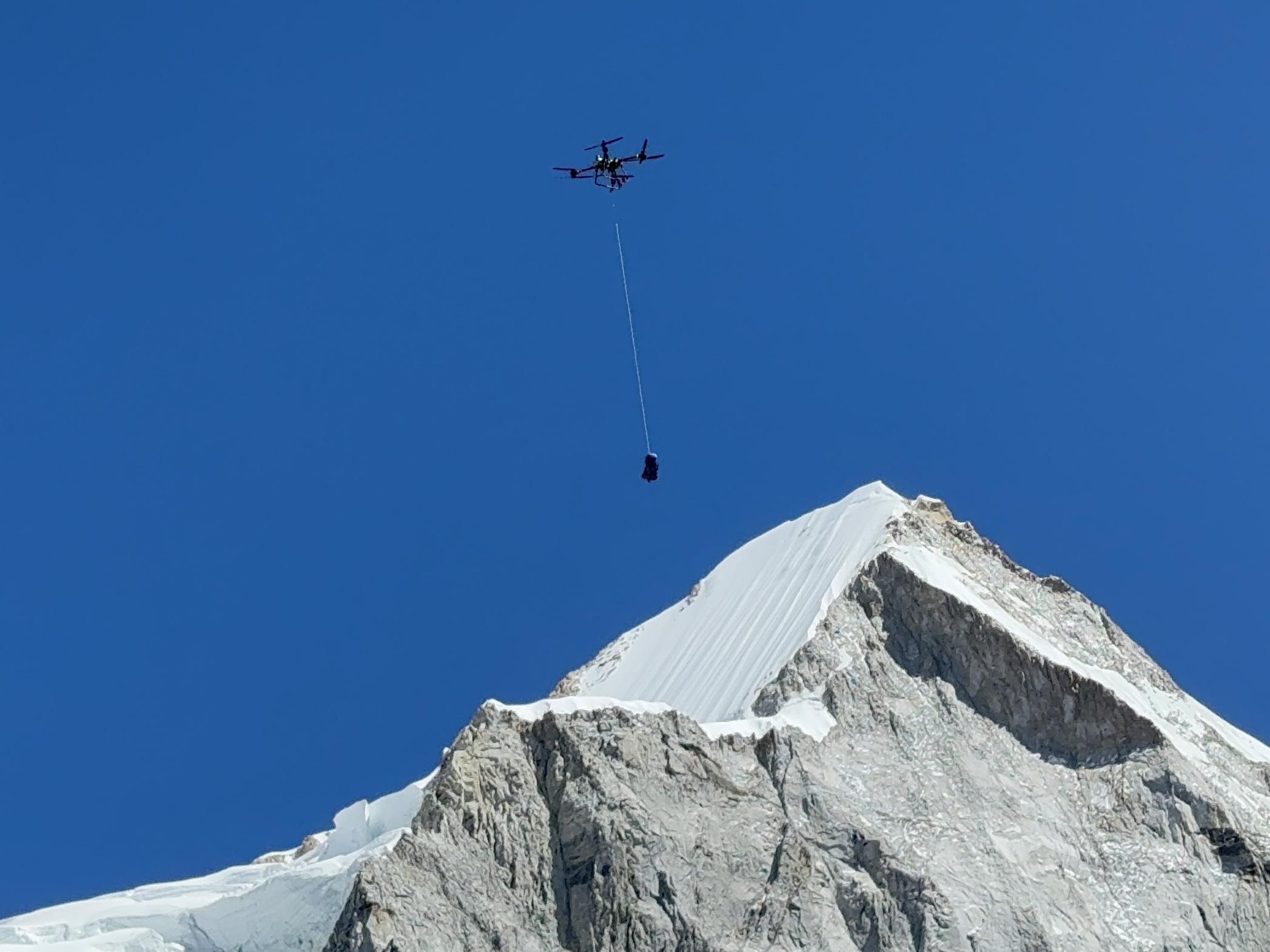 DJI drone flying over Khumbu Icefall during a delivery test on Mount Qomolangma from the Nepali side. Photo by Xinhua.