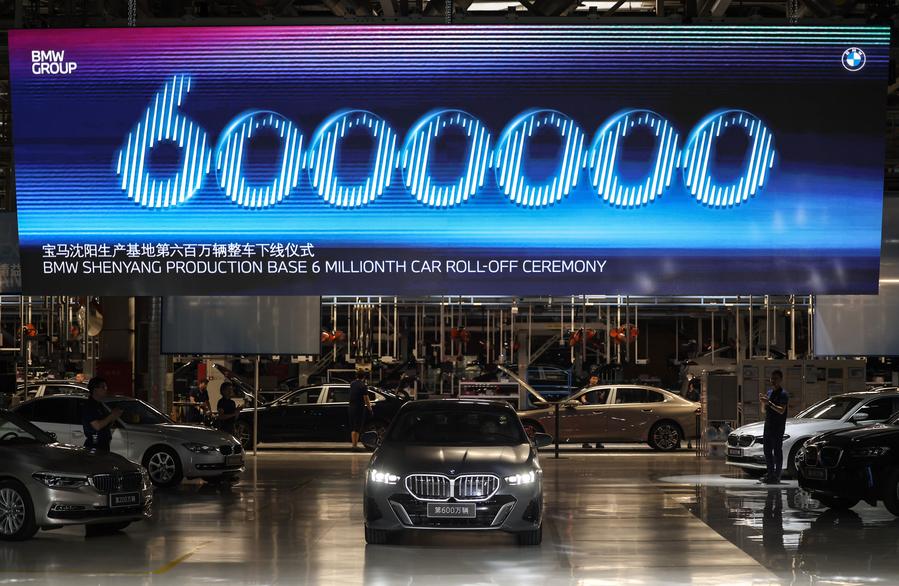 A roll-off ceremony of the 6 millionth car produced by BMW Brilliance Automotive (BBA) in Shenyang, northeast China's Liaoning Province. Photo by Xinhua/Pan Yulong.