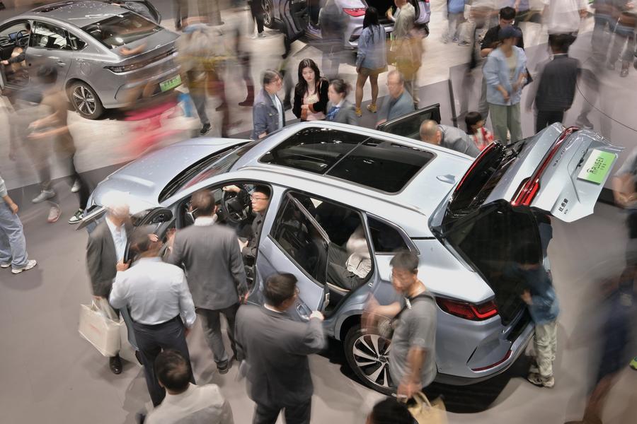 Visitors watch a vehicle of Song PLUS by Chinese NEV manufacturer BYD during the 2024 Beijing International Automotive Exhibition in Beijing, capital of China. Photo by Xinhua/Yin Dongxun.